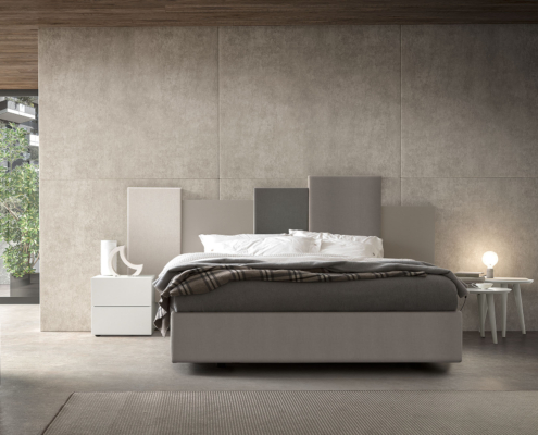 Letto con testiera boiserie in diverse tonalità di grigio